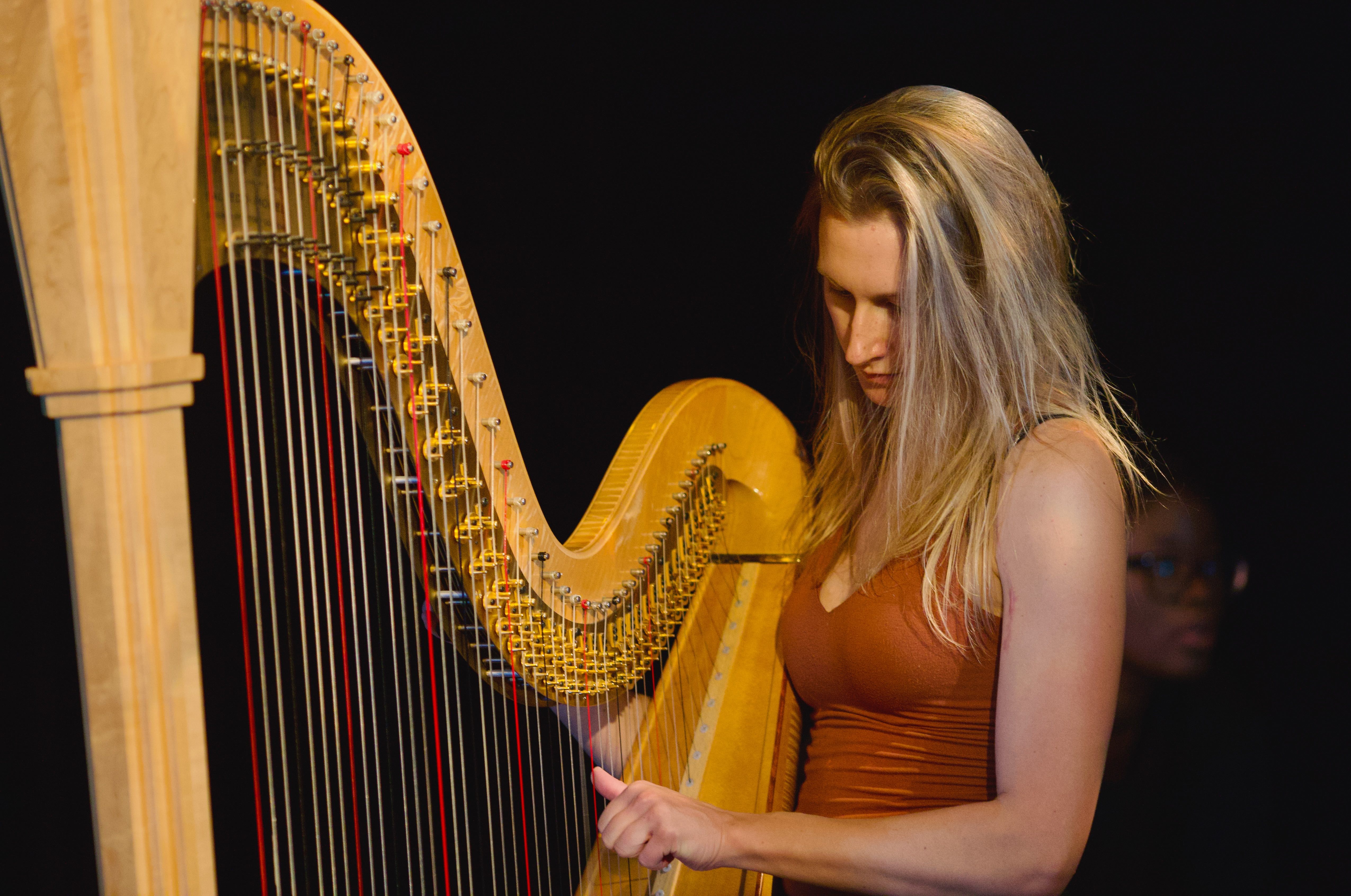 Volunteer tuning before the afternoon sets